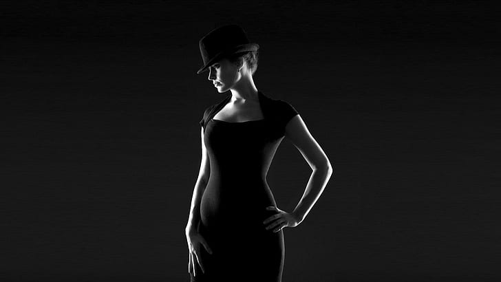 Model with a hat, women's black cap sleeve dress; black fedora hat
