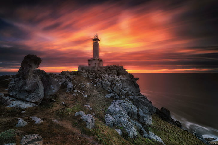 photo of lighthouse near sea, sunset, sunrise, colors, clouds