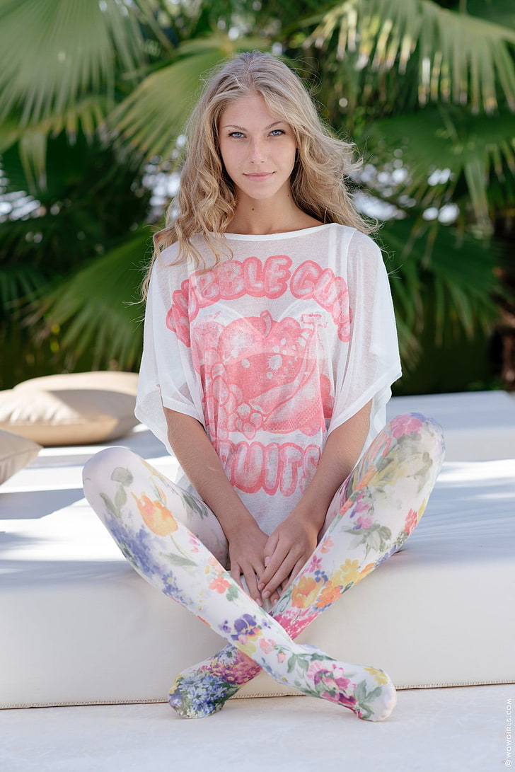 women's white and pink batwing-sleeved top, Krystal Boyd, blonde