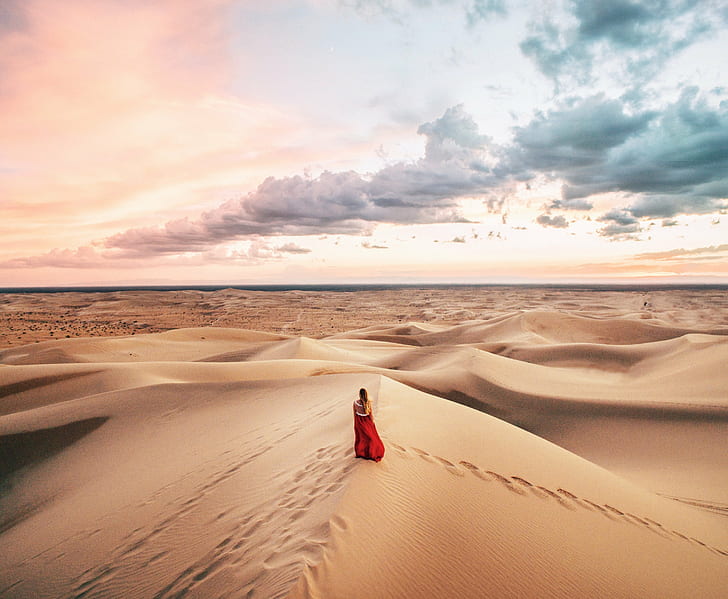 woman in red long dress walking in desert under cloudy sky during daytime, HD wallpaper