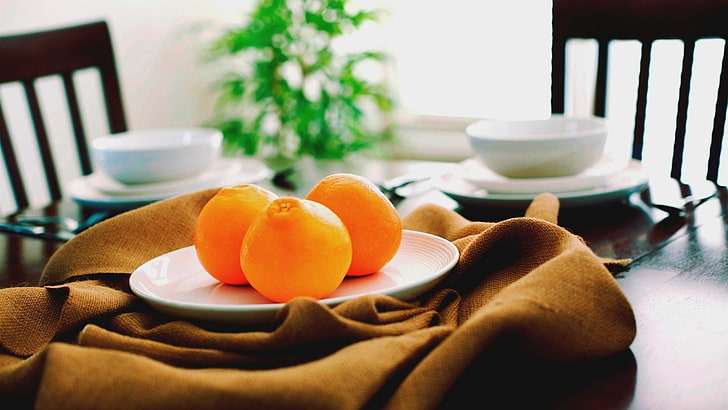three orange fruits, orange (fruit), plates, table, food and drink