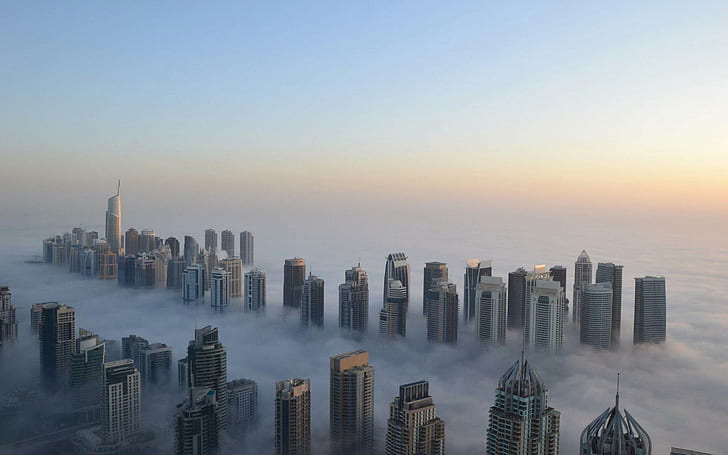 Dubai covered in fog, city skyline of high rise buildings, world
