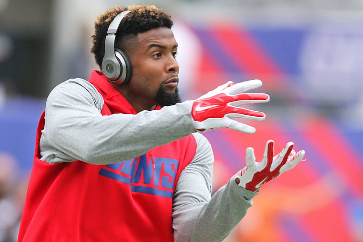 odell beckham jr, national football league, football, men's red and gray pullover hoodie, red-and-white nike gloves and gray headphones