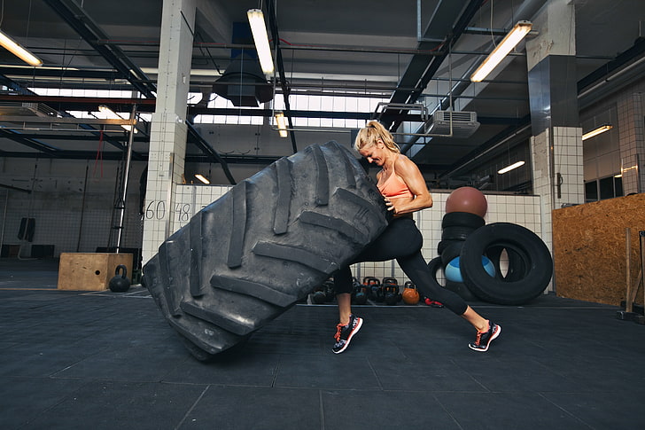 woman, crossfit, giant tire, explosive force, real people, full length