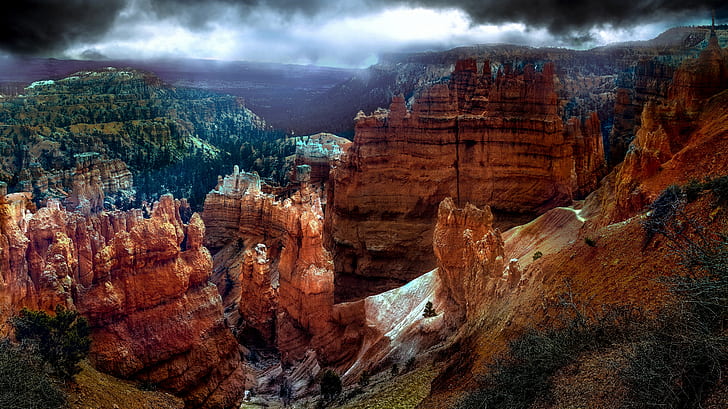 high angle photo of rock formations under black and white sky during daytime, bryce canyon, bryce canyon