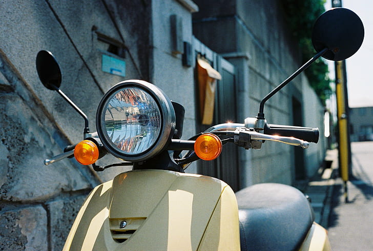 close up photo of beige motor scooter, Early Summer, 40mm, Minolta