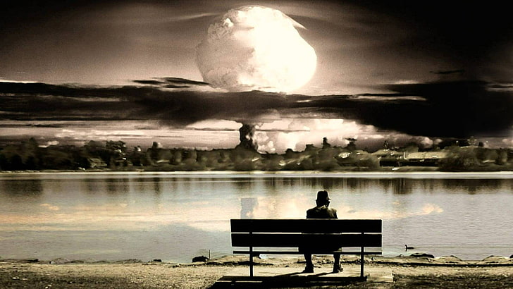 man sitting on bench while looking at the moon graphic wallpaper