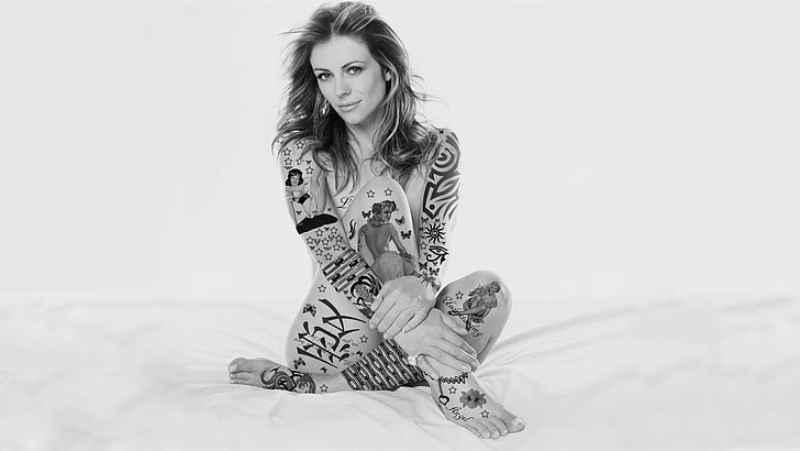 woman sitting on white surface wallpaper, Elizabeth Hurley, tattoo