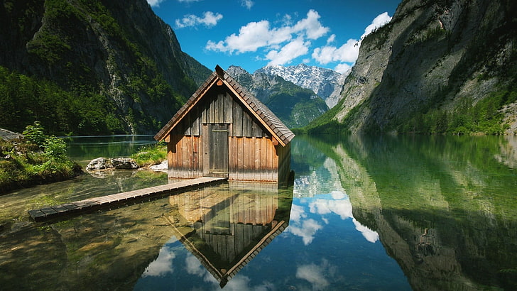 brown wooden house on body of water near mountain, lake, cabin