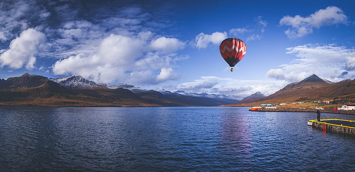 hot air balloon on sky above body of water under blue sky, Up