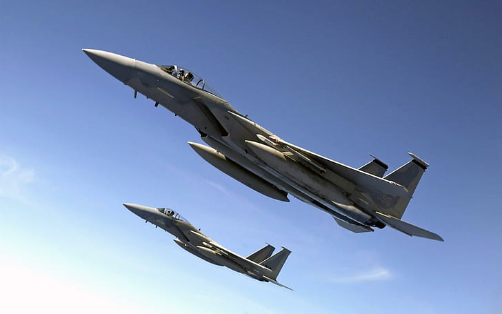 F 15 Eagles Fly Over the Pacific Ocean, two gray fighter plane