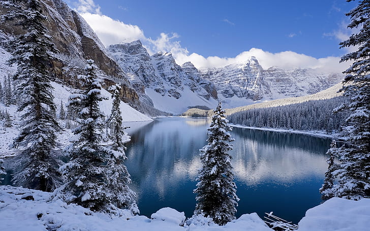 Winter, snow-covered mountains and trees, icy lake, snow covered mountain range