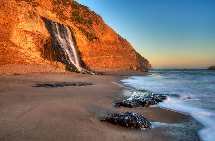 photography of sea waves near brown rock mountain, california, california