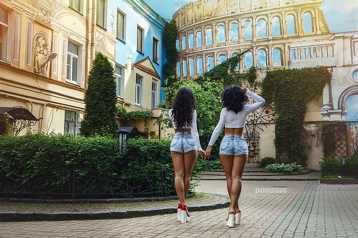 two women's acid-washed short shorts, jean shorts, back, wavy hair, HD wallpaper