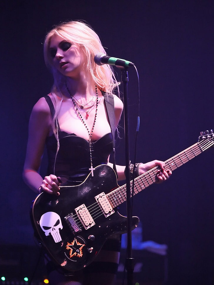 women's black spaghetti-strap top and electric guitar, Taylor Momsen