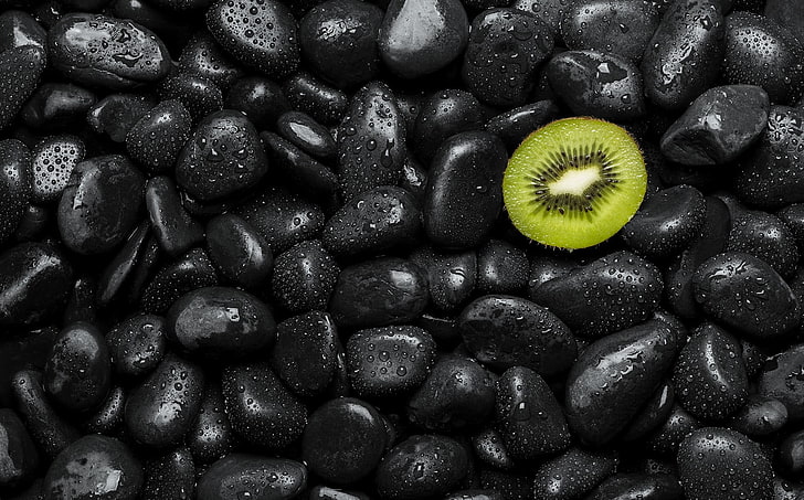 black and yellow plastic balls, kiwi (fruit), water drops, stones