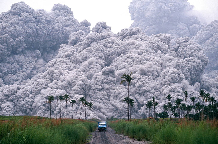 blue vehicle and grass field, volcano, dust, eruptions, landscape
