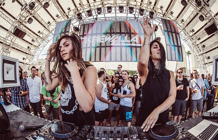 two women in front of DJ turn table, Krewella, music, group of people