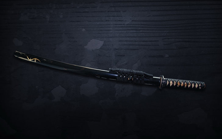 black handled katana, sword, indoors, single object, black color