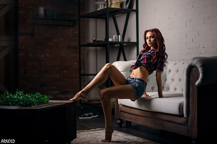 women, tanned, jean shorts, plaid shirt, belly, couch, plants