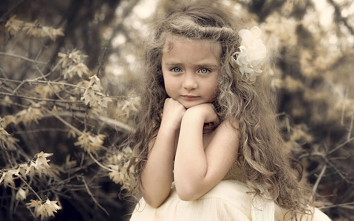 Beautiful cute girl, portrait, curls, flower