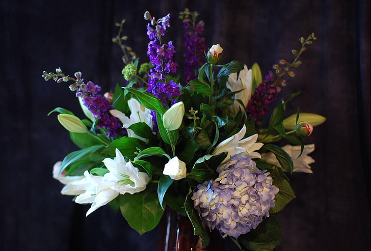 white trumpet lilies, purple delphinium flowers, and purple hydrangea flowers bouquet