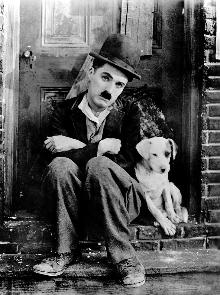 Charlie Chaplin, The Tramp, sitting, full length, representation