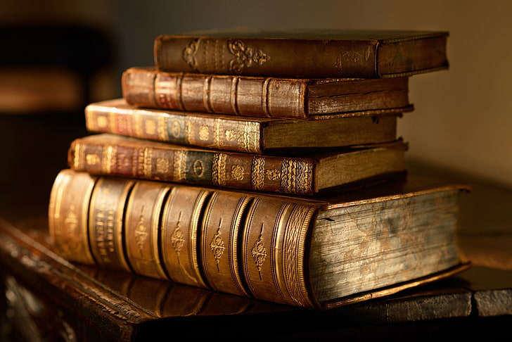 pile of brown books, macro, table, blur, stack, vintage, bokeh