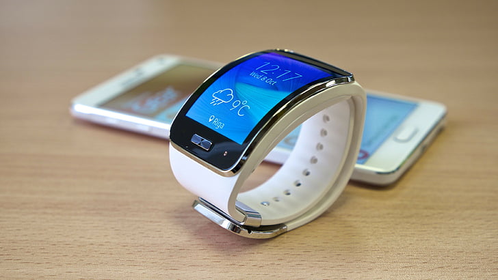 turn-on Samsung Gear beside smartphone, Samsung Galaxy Gear Watch