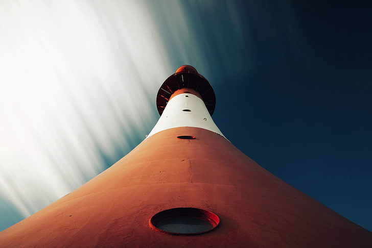 low angle photo of white and brown lighthouse, worm's eye view