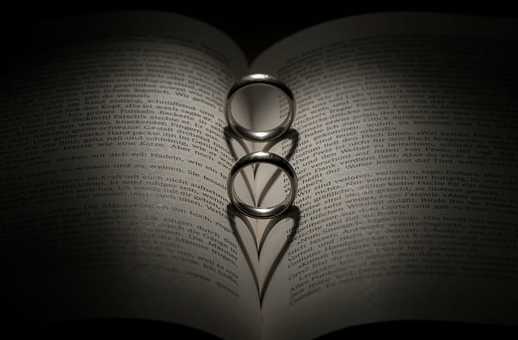 two silver-colored rings on book page, bind, lord of the rings