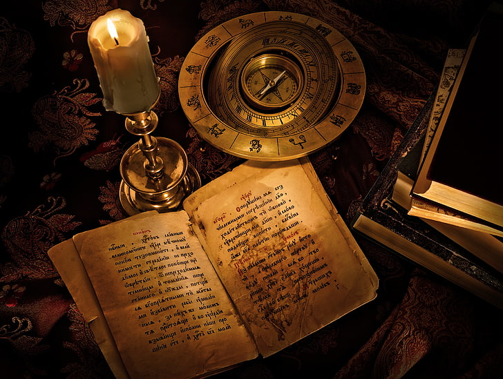 brown book, the inscription, books, candle, compass, the signs of the zodiac