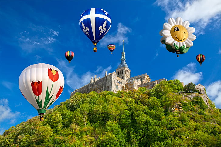 selective focus photography of flying hot air balloons on top of brown castle, mont saint-michel, mont saint-michel