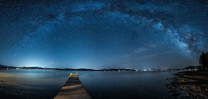 brown wooden boat dock with blue sky at night time, tahoe city, tahoe city