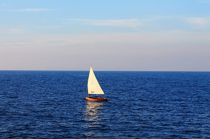 photo of a white and brown sail boat on body of water, sailing boat
