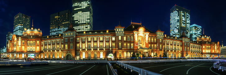 photo of building with yellow lights beside concrete road, tokyo station, tokyo station