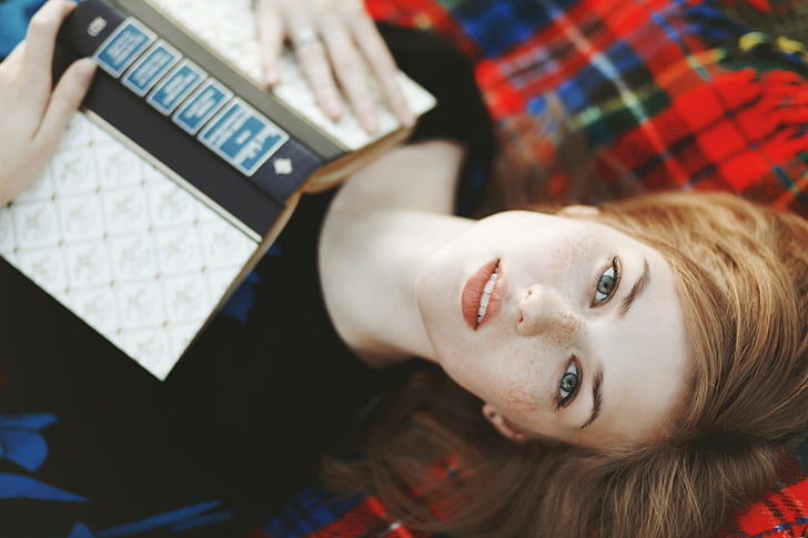 women, redhead, freckles, books, looking at viewer, lying on back