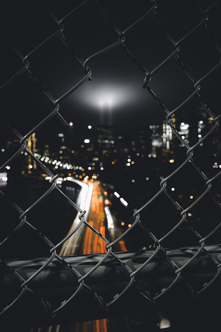 night city, fence, mesh, glare, blur, HD wallpaper