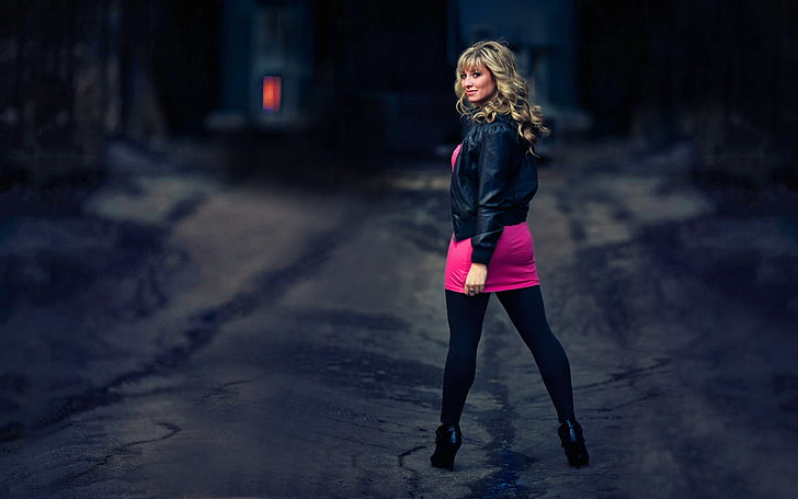 women's pink skirt, blonde, looking back, curly hair, leather jackets