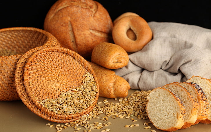 brown wicker bread basket, pastries, muffins, bagels, cereals