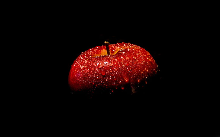 Red apple, black background