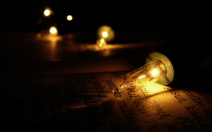 light bulb, text, indoors, no people, illuminated, close-up