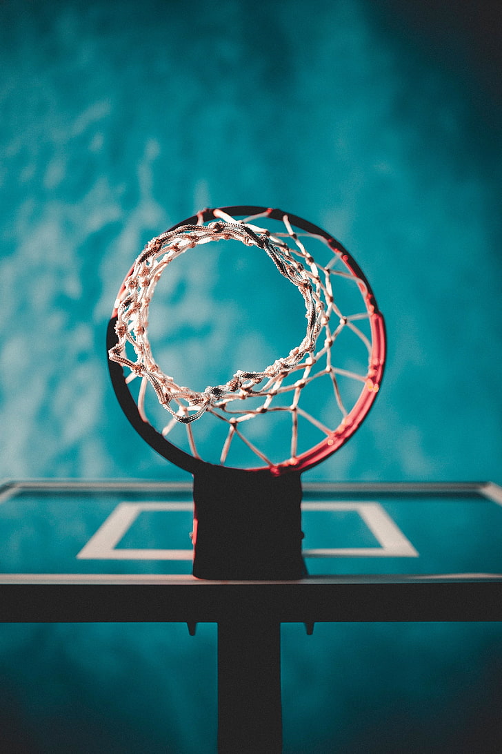 red and white basketball hoop system, basketball ring, mesh, blur