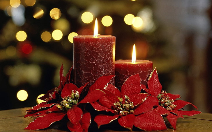 two red pillar candles, flowers, bokeh, holiday, Christmas, decorations