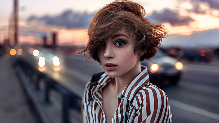 women's white and brown striped top, short hair, blue eyes, portrait
