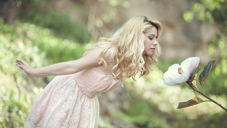 women's pink sweetheart neckline dress, blonde, curly hair, flowers