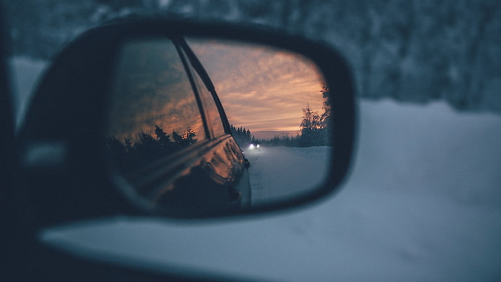 unpaired black vehicle side mirror, photography, sunset, clouds
