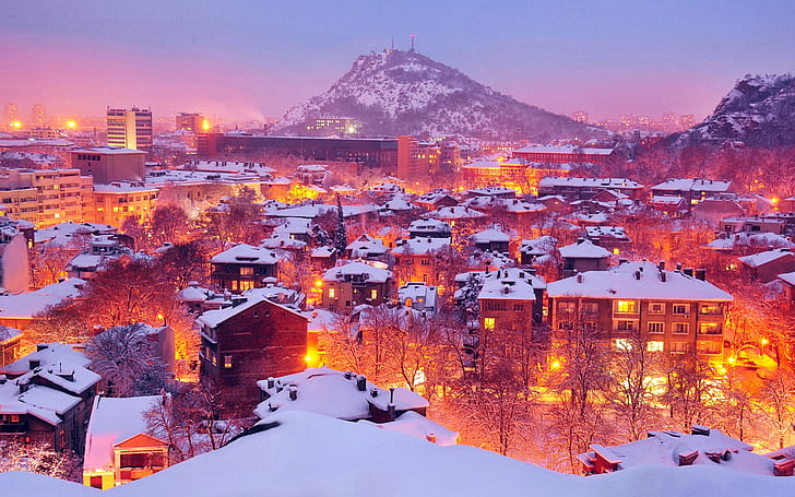 Plovdiv, Bulgaria, city covered of snow with orange street lights