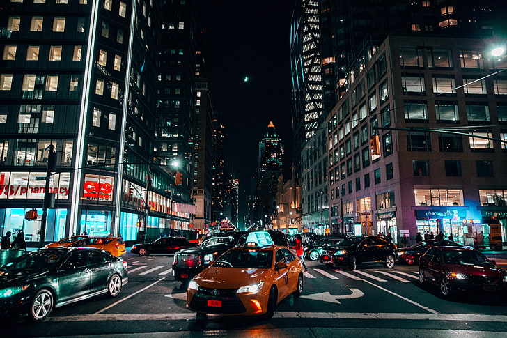 orange Toyota Corolla sedan, night city, cars, traffic, new York City