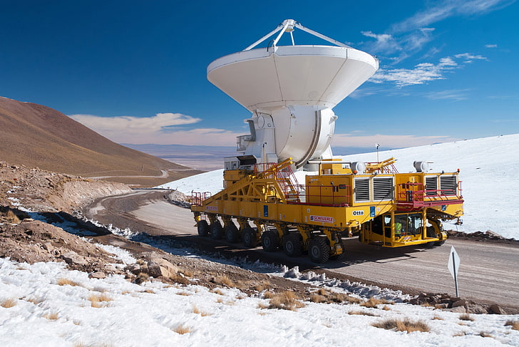 yellow and white mobile radar, mountains, desert, height, North